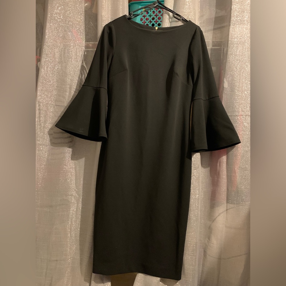Calvin Klein Black Dress size 6. Gold back zipper. No flaws. Offers welcome.